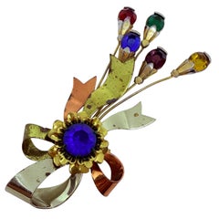 Spilla di design in vetro colorato d
oro, rame, argento, vintage.