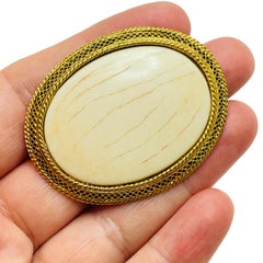 Vintage gold cream designer brooch