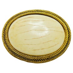 Vintage gold cream designer brooch