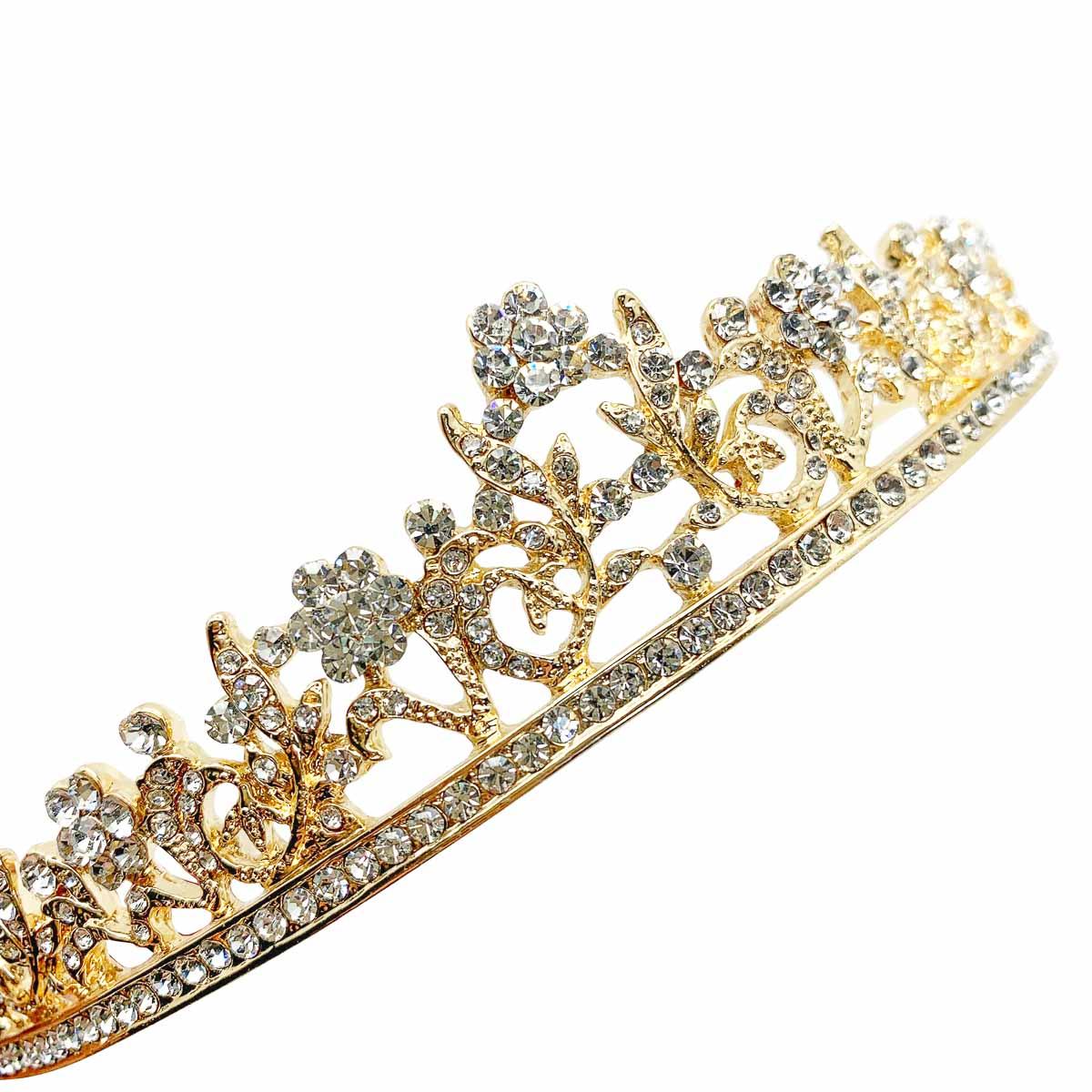 A delightful vintage floral tiara. Enjoy the age-old tradition on your wedding day with this emblem that signifies the crowning of love.

Vintage Condition: Very good without damage or noteworthy wear.
Materials: gold plate, glass crystal
Signed: