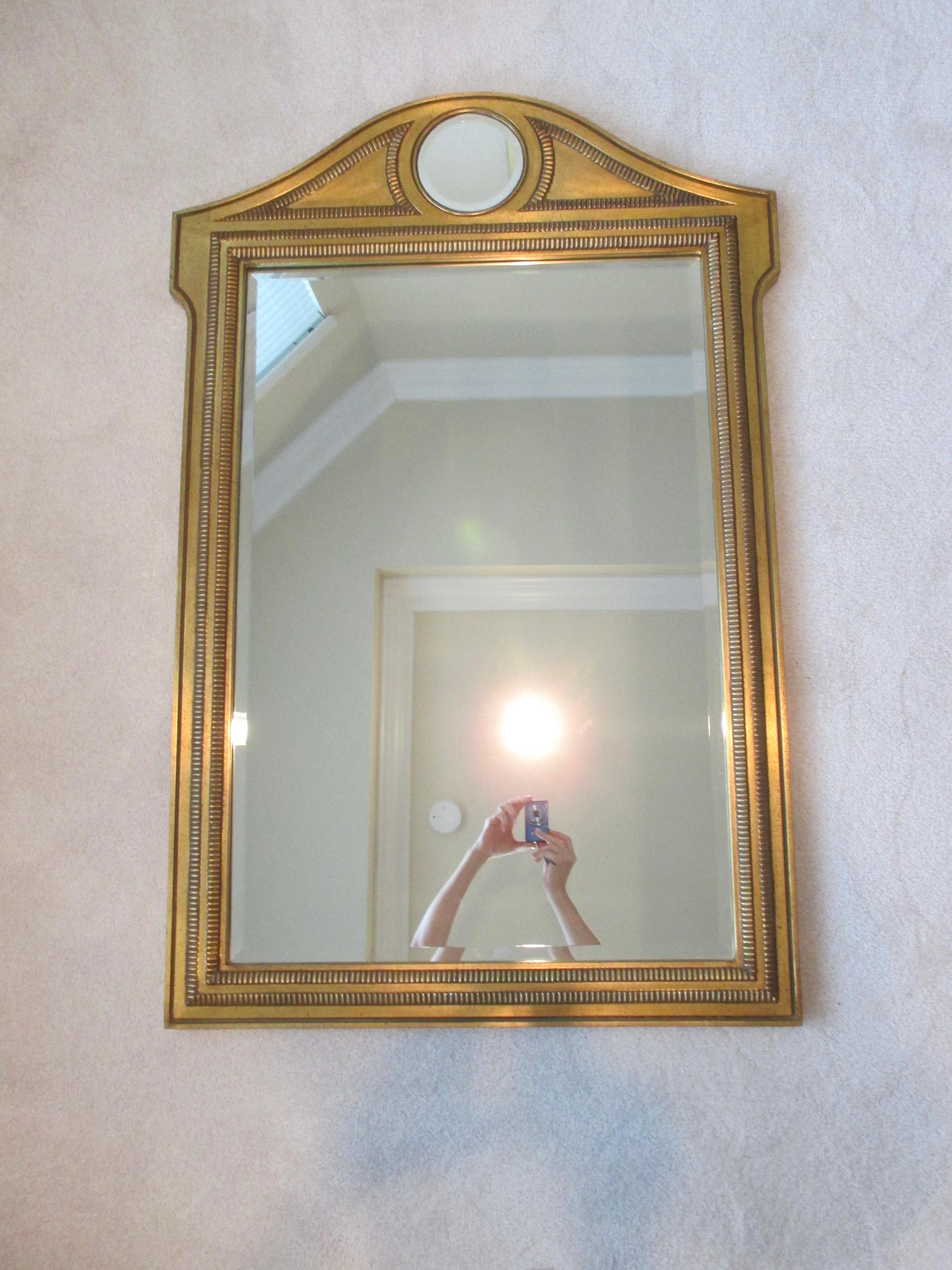 Beautiful gold decorative wooden mirror made in Belgium with tiny black flecks. Hanging hardware is attached.