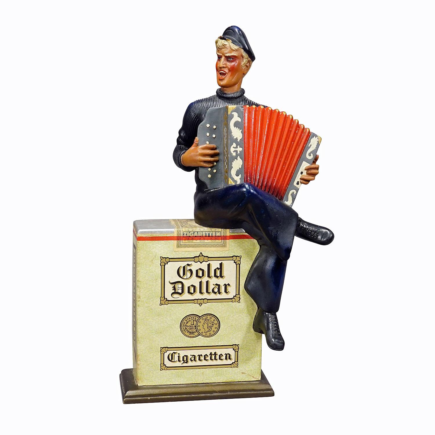 Vintage Gold Dollar Cigarettes Advertising Sculpture 1950s

This old BAT (British American Tobacco) advertising figure made of wood and plaster advertising the cigarette brand 