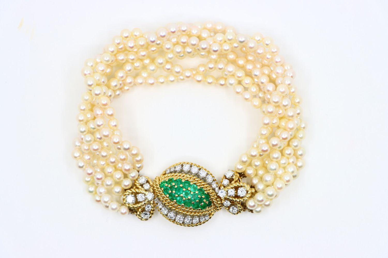 Vintage Gold Emerald Diamond Muti-Stand Pearl Bracelet

Approximate Dimensions:
21.7 cm (Unclasped Length) 
2.5 cm (Width) 
Approx. 2.09 ct (Emerald) 
Approx. 2.96 ct (Diamond) 
4.07 mm (Pearl) 
56.1 grams in weight.