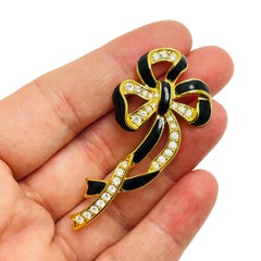 Vintage gold enamel rhinestone bow brooch