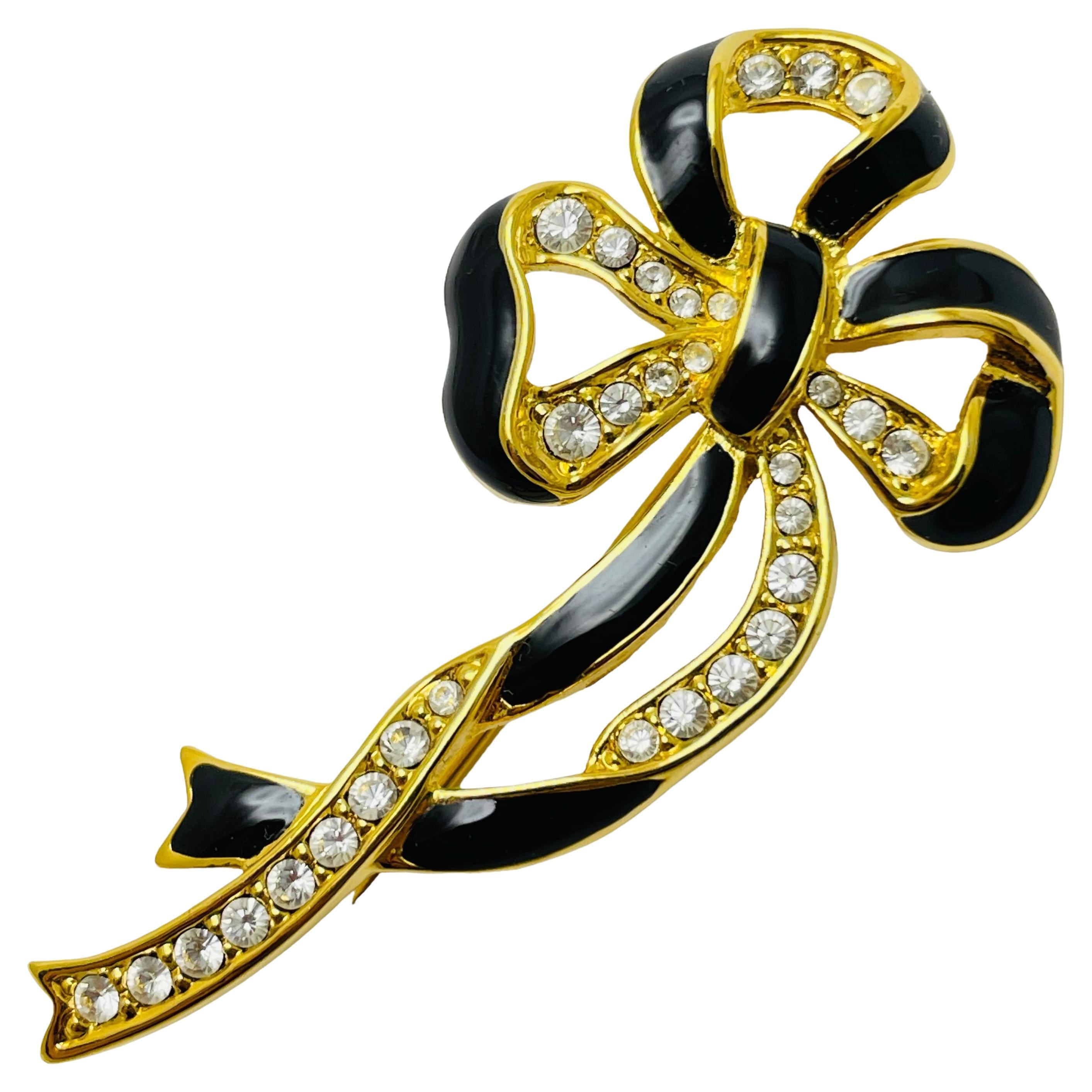 Vintage gold enamel rhinestone bow brooch For Sale