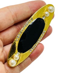 Vintage gold enamel rhinestone designer brooch
