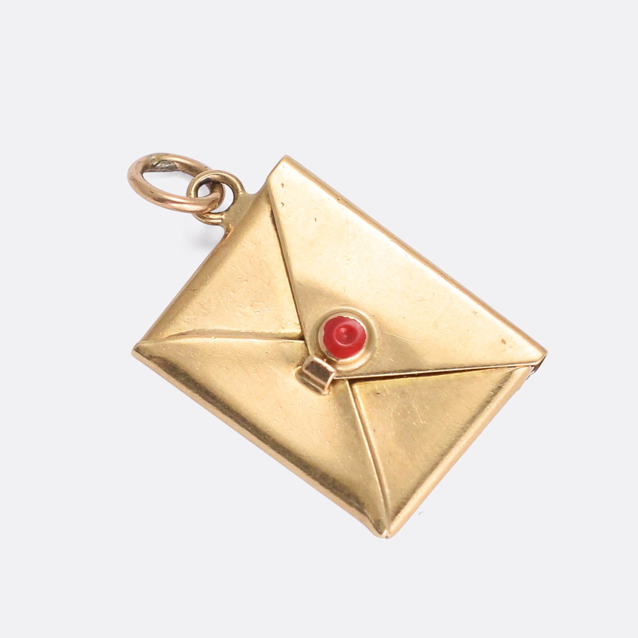 A sweet vintage envelope charm dating from the 1950s. It features enamelled seal wax on the flap, which opens to reveal a small compartment space within. With clear London hallmarks dating in to 1959.

MEASUREMENTS 
1.2 x 1.7cm

WEIGHT 
1.3g

MARKS