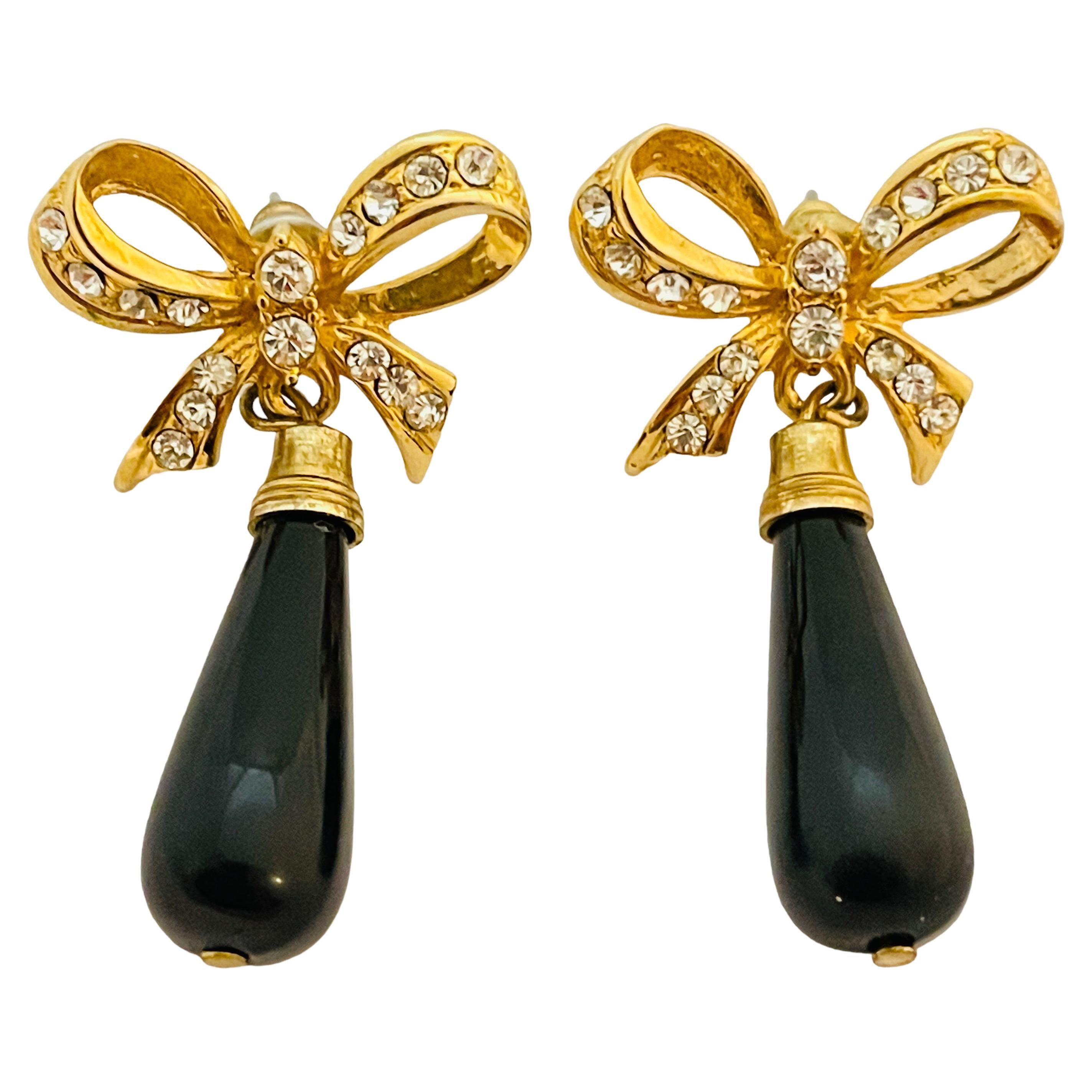 Vintage gold glass rhinestone bow designer runway pierced earrings For Sale