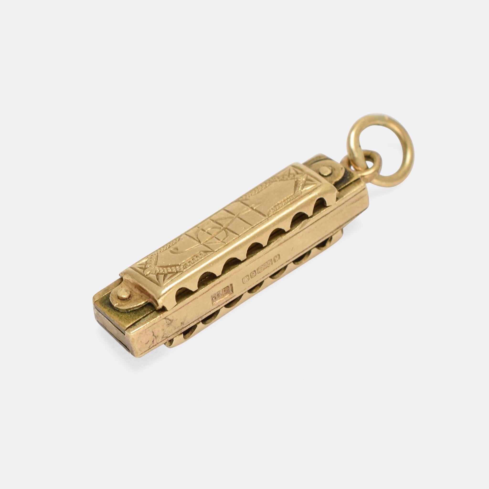 This cool vintage harmonica charm is crafted from 9k gold and actually works! You can blow in, or draw out, and a chord sounds with the same reedy tone of the full sized instrument. It's fully hallmarked for the year 1964, Sheffield assay