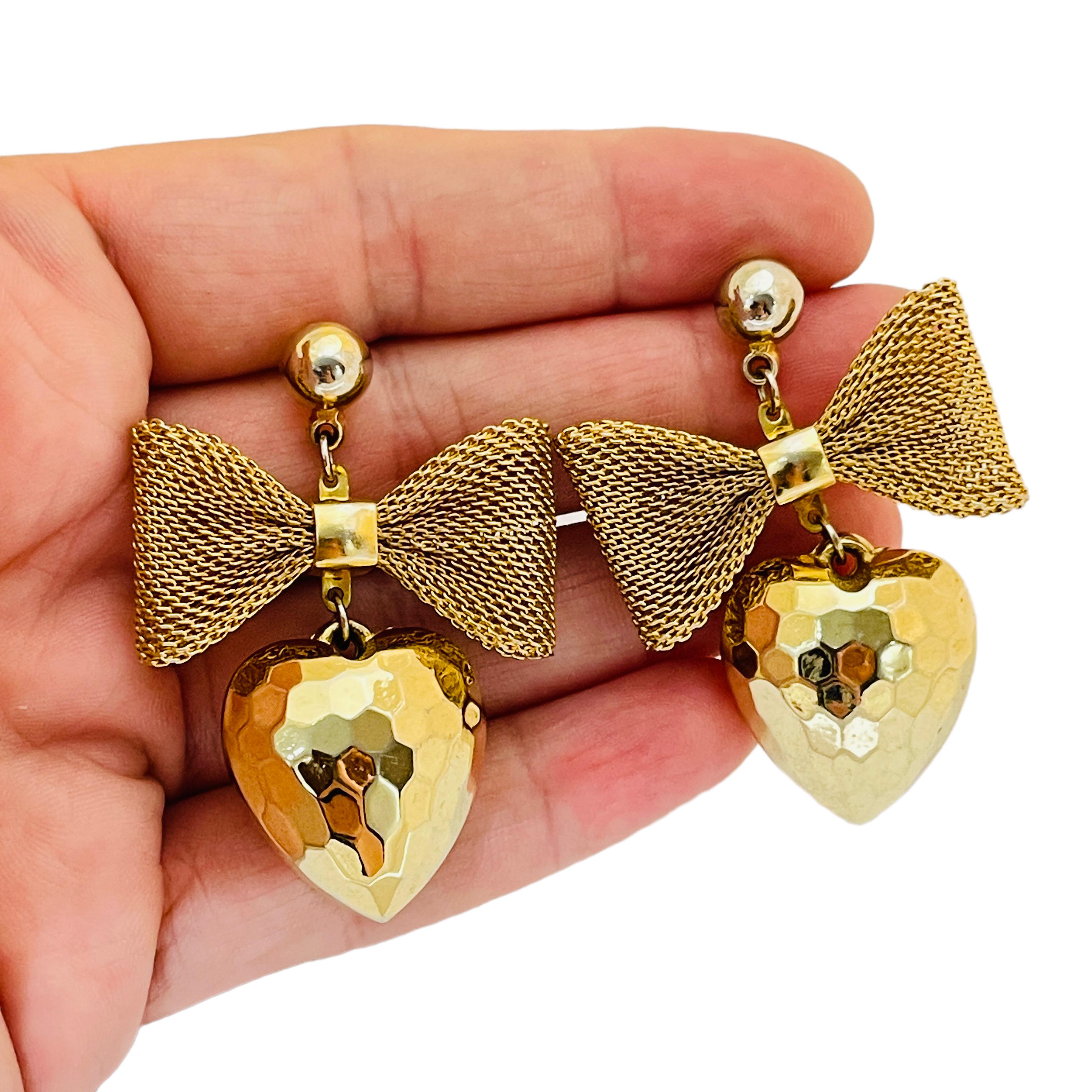 DETAILS

• unsigned

• gold tone 

• vintage designer pierced earrings

MEASUREMENTS

• 1.88