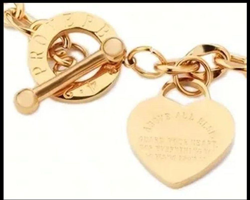 Moderne Bracelet vintage à maillons triangulaires et cœur en or  en vente