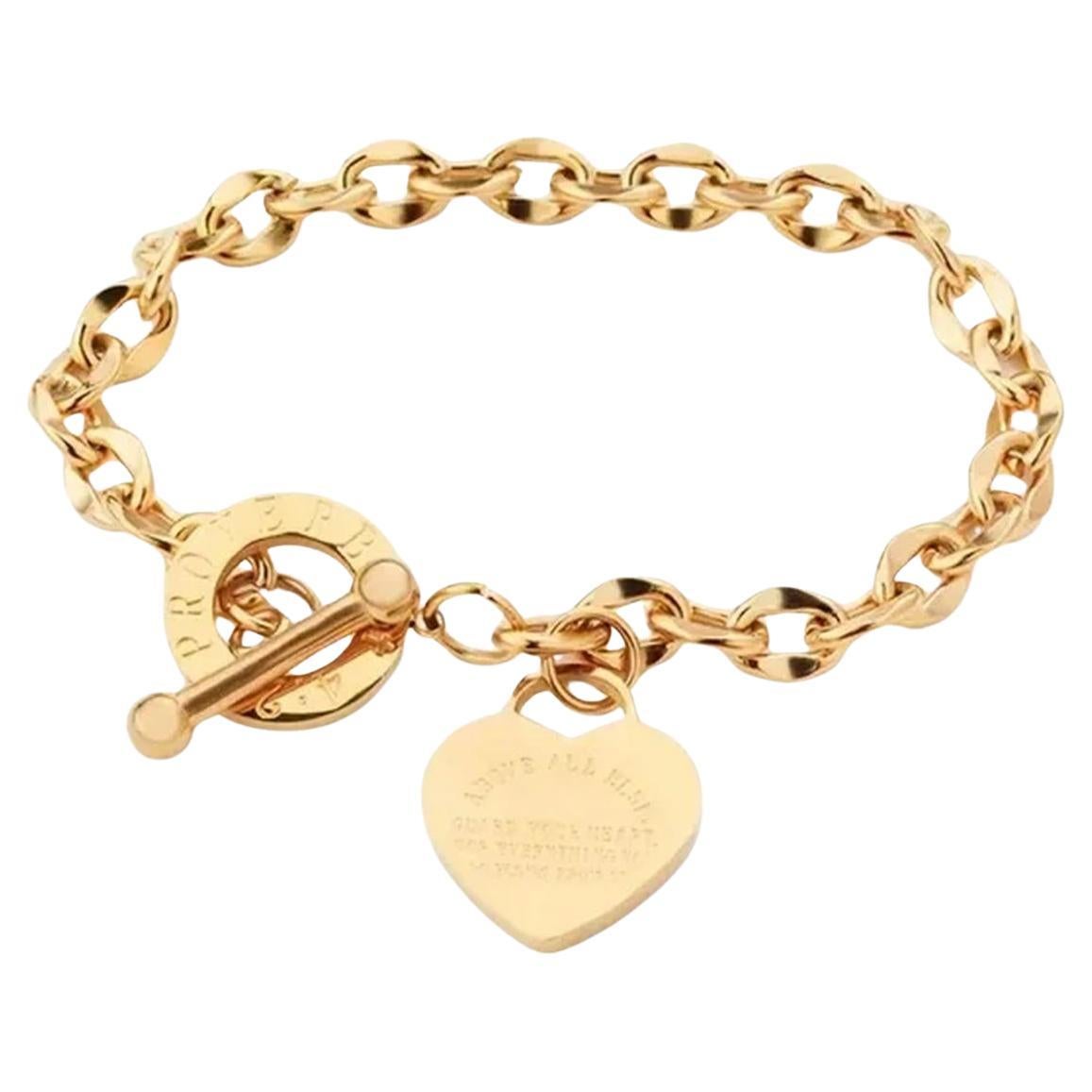 Bracelet vintage à maillons triangulaires et cœur en or  en vente