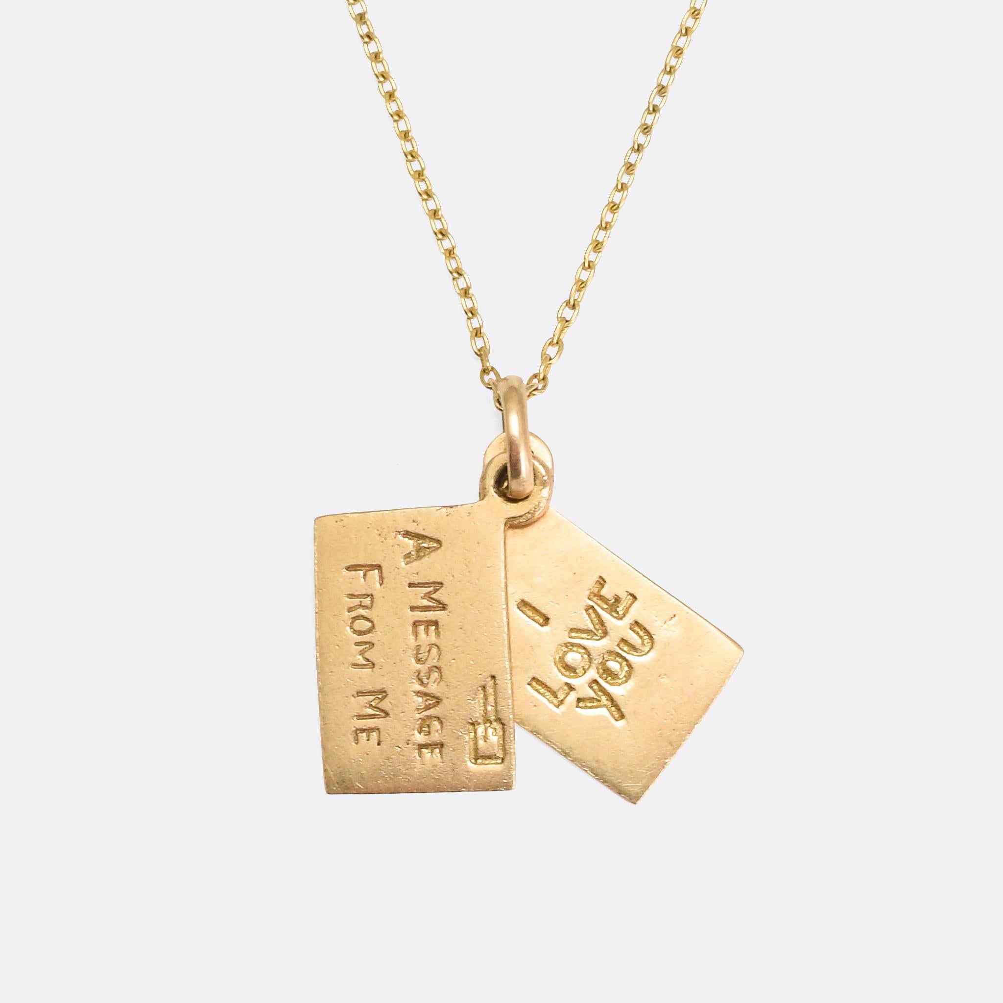 A sweet vintage love token dating from the 1960s. It features two letters, one is carved with the words I LOVE YOU, and the other A MESSAGE FROM ME - with envelope detailing to the outside. It's modelled in 9 karat gold with English hallmarks dating