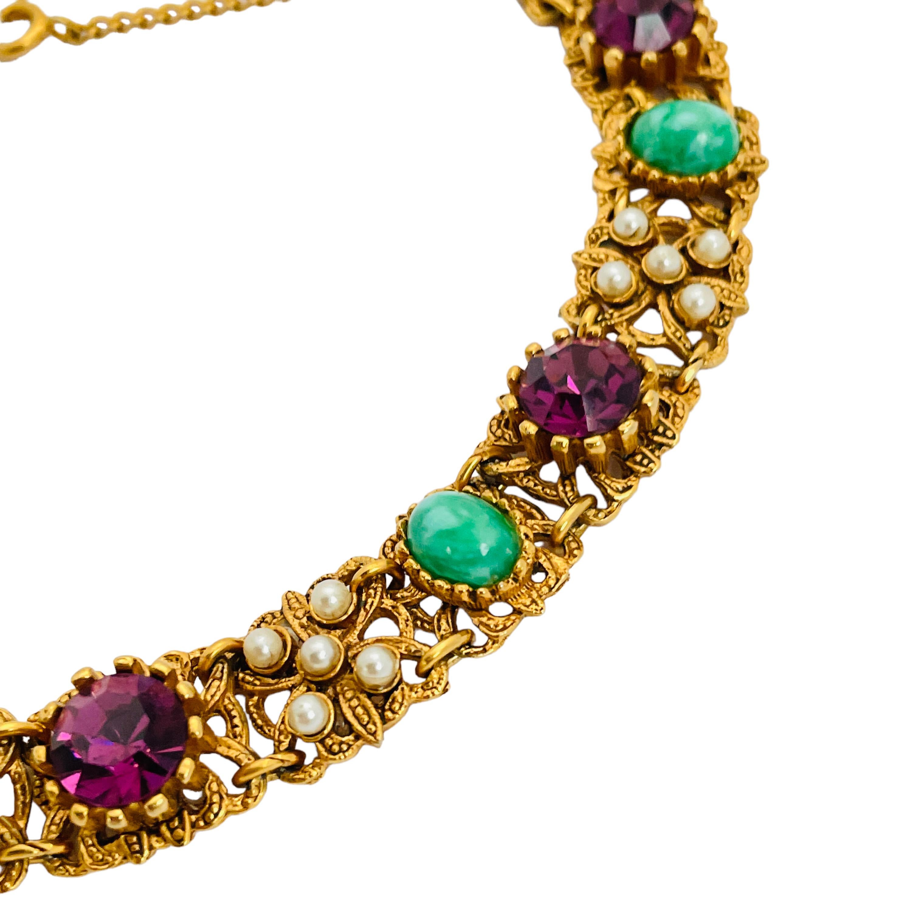 DETAILS

• unsigned 

• gold tone with glass stones

• vintage designer runway bracelet 

MEASUREMENTS

• 7.25