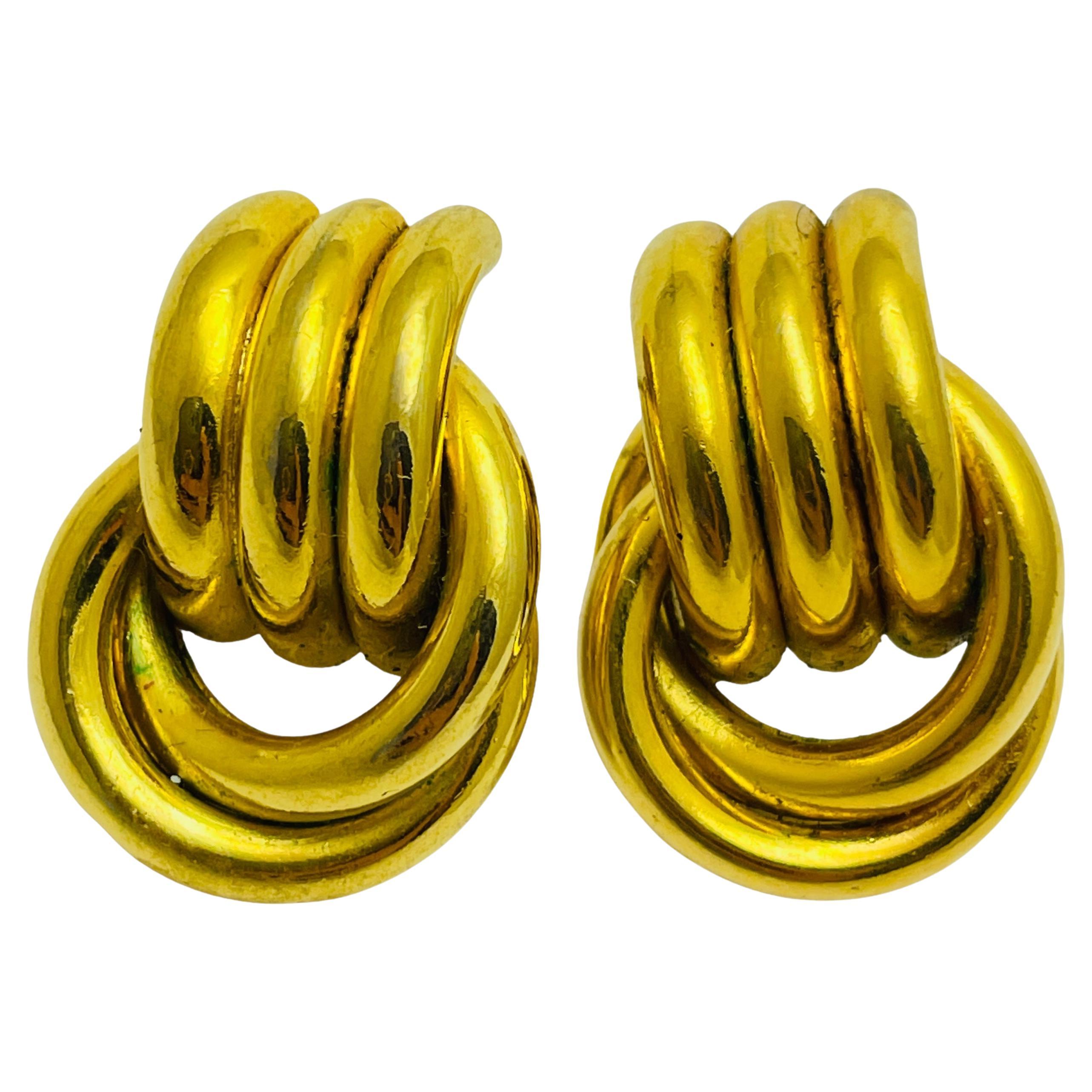 Vintage gold knot designer runway earrings For Sale