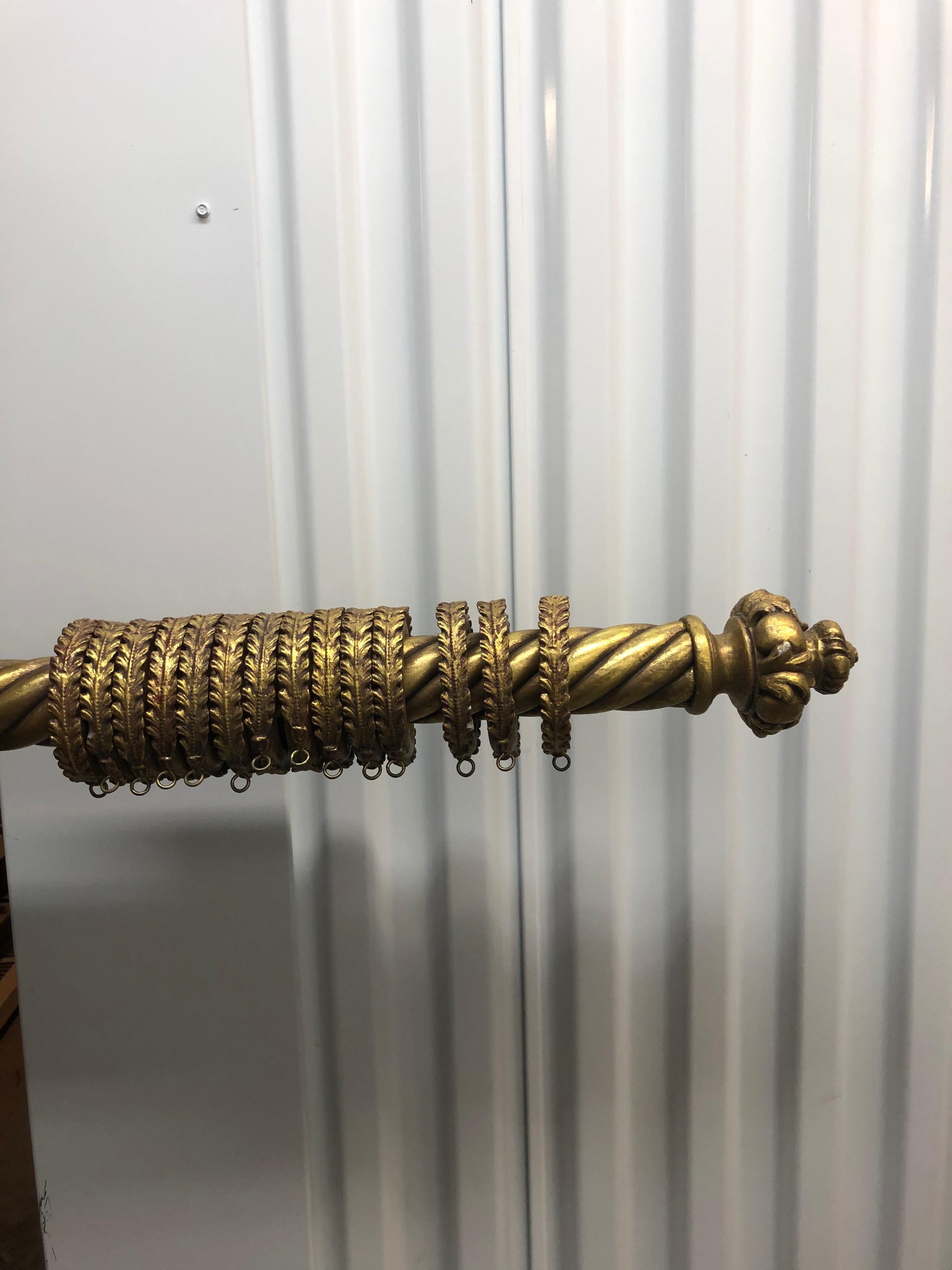 Vintage gold leaf Italian carved wood curtain pole with plastic finials that look like real wood and brackets are wood.
Thick 3