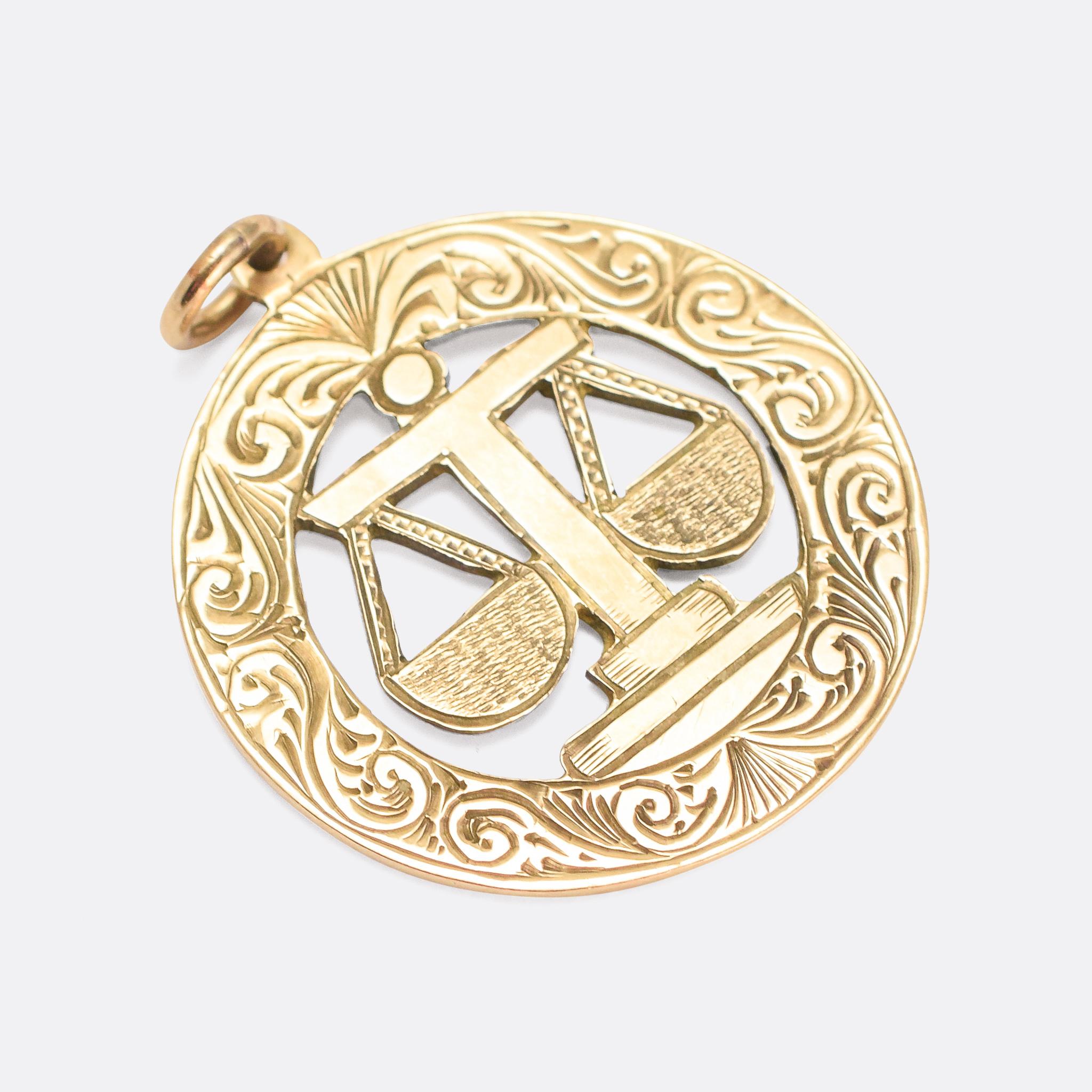 A substantial vintage Zodiac medallion dating from the 1970s. It's modelled in 9k gold, and depicts the scales of Libra - beautifully openworked and adorned with hand-chased scrolled detailing. With clear Edinburgh hallmarks dating from the year
