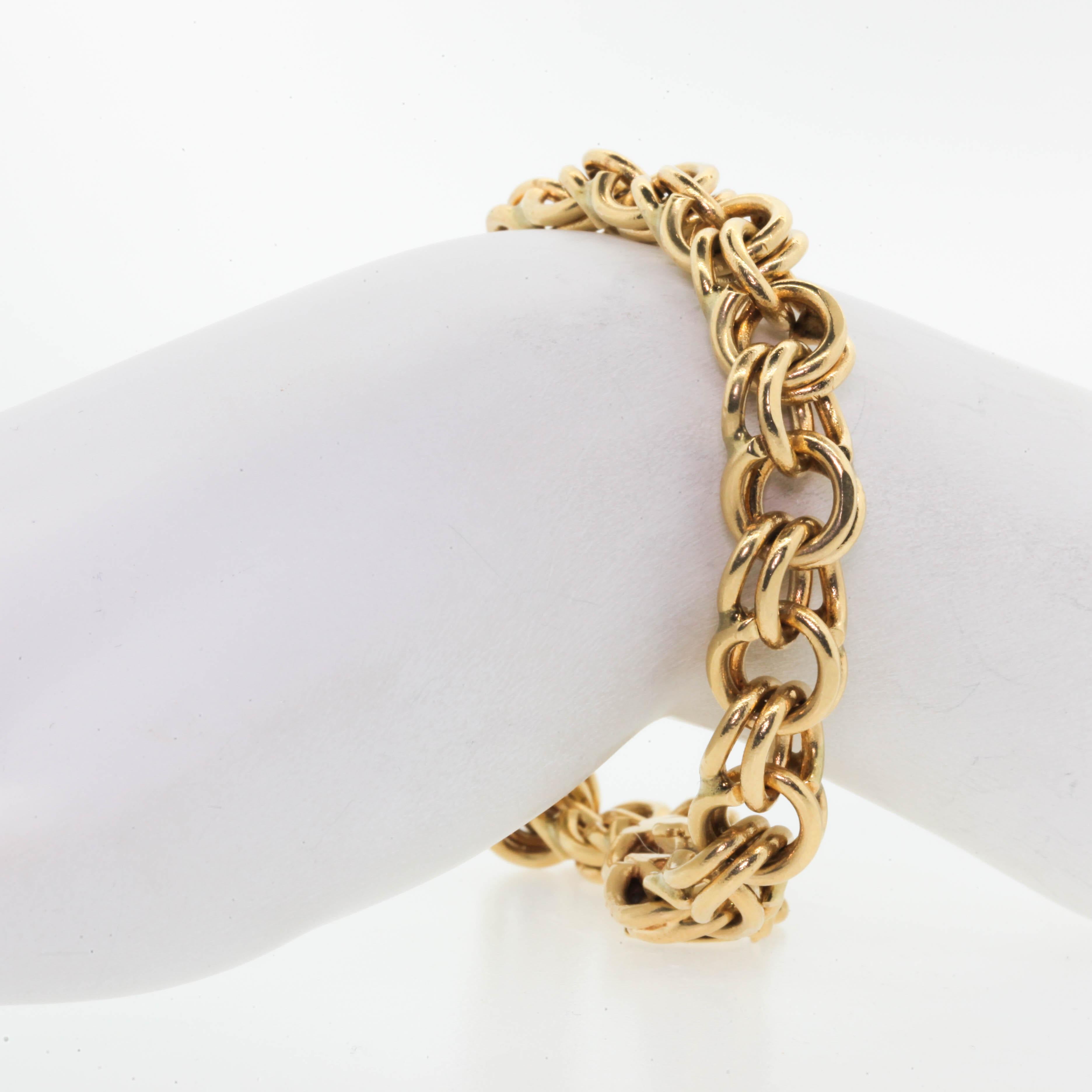 This is  the iconic gold bracelet from the 1950s & 1960s that can be worn as is or with charms added.  The double circle links give it a buttery feel to 7 7/8 inch long bracelet.  Your everyday bracelet!