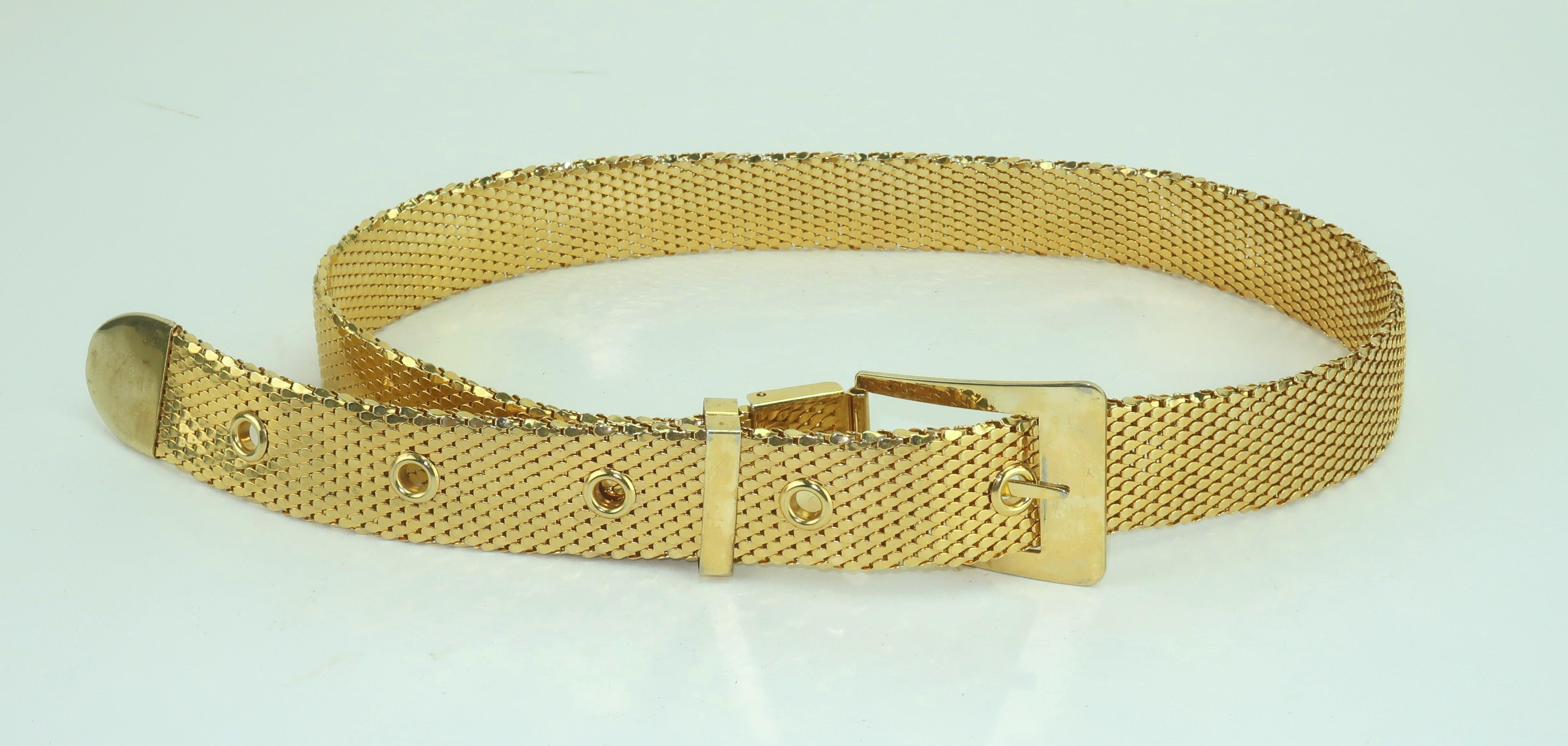 Disco glam!  Vintage gold mesh belt in the manner of Whiting & Davis.  There are five adjustable options for the perfect fit.  No maker’s mark.
CONDITION
Good previously worn condition.
MEASUREMENTS
The belt measures a total of 32” from end to end