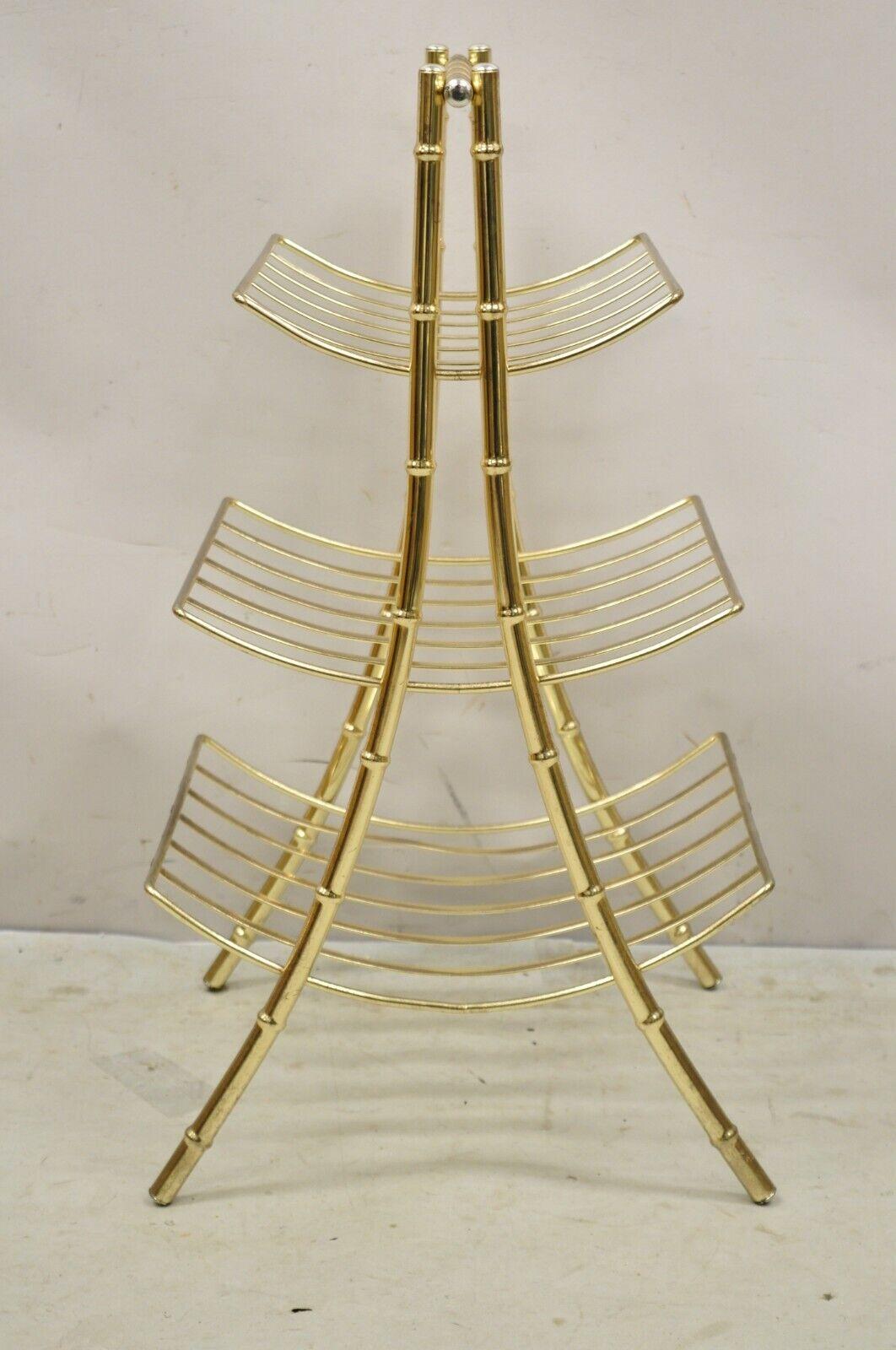 Vintage Gold Metal Faux Bamboo 3 Tier Hollywood Regency Magazine Rack Stand. Circa Late 20th Century. Measurements: 27