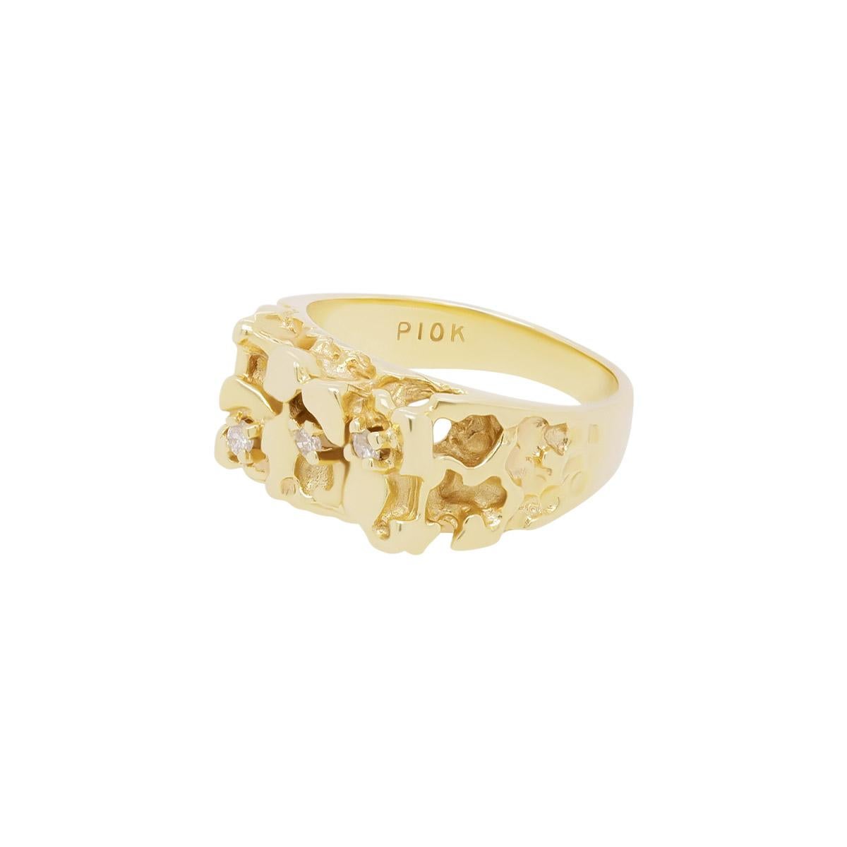 This unique chunky solid 10K gold ring is a vintage one of a kind piece, designed with three 2mm diamonds set diagonally across the top of a gold nugget pattern. Suitable for both women and men this piece can be worn as a stand alone statement ring
