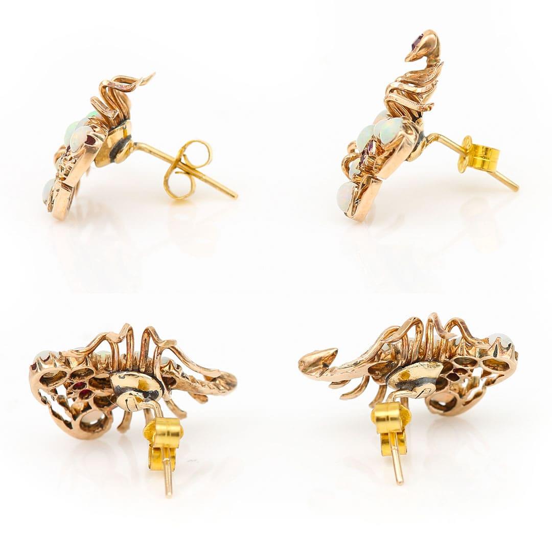 A fabulous and unique pair of 9ct rose gold insect stud earrings formed in the shape or scorpions. The body and pincers are set with lively, round cabochon opals with electric greens, pinks and blues. Furthermore the eyes and tail (with its sting