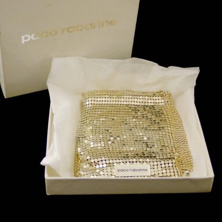Vintage Gold PACO RABANNE Disco Mesh Scarf

Measurements:
Height: 3.35 inches (8.5 cm)
Length: 41.33 inches (105 cm)

Features:
- 100% Authentic PACO RABANNE.
- Metal disco mesh in light gold tone.
- Signed PACO RABANNE.
- Paco Rabanne box