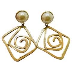 Boucles d'oreilles vintage à clip en perles dorées