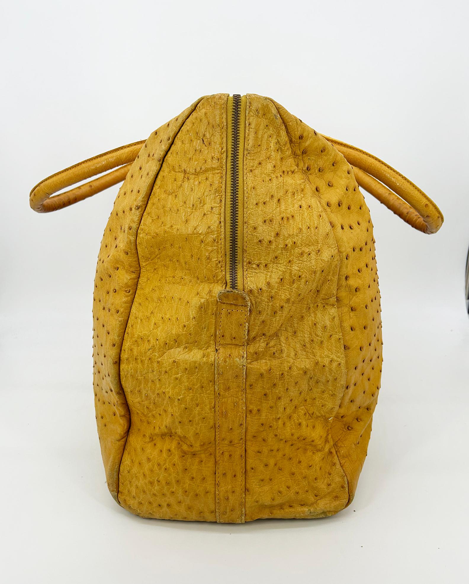 Vintage Gold Pfeil Mustard Tan Ostrich Leather Duffel Travel Bag Tote c1980s in fair condition. Beautiful mustard yellow tan ostrich leather exterior in large duffel travel carry on size tote. Double top handles. Large top zipper closure opens to a