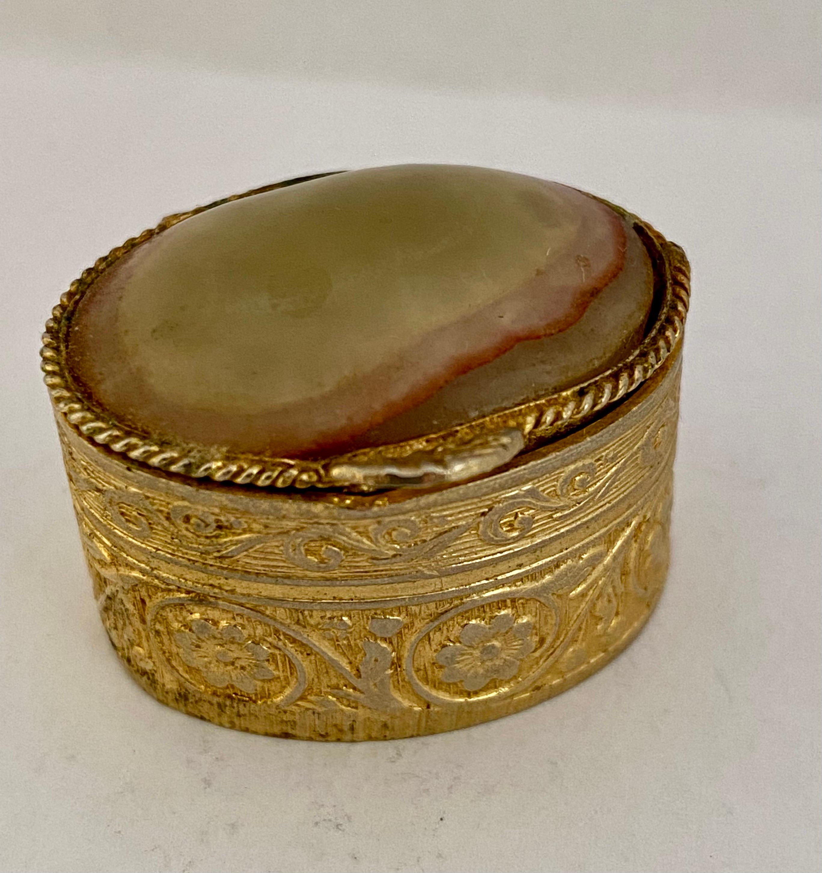 This beautiful pre-owned miniature ornate pill box is in good condition. Visible signs of ageing and wear. Please study the images carefully as form part of the description.