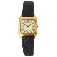 Vieille montre mécanique Bulova carrée pour femme en plaqué or et acier inoxydable