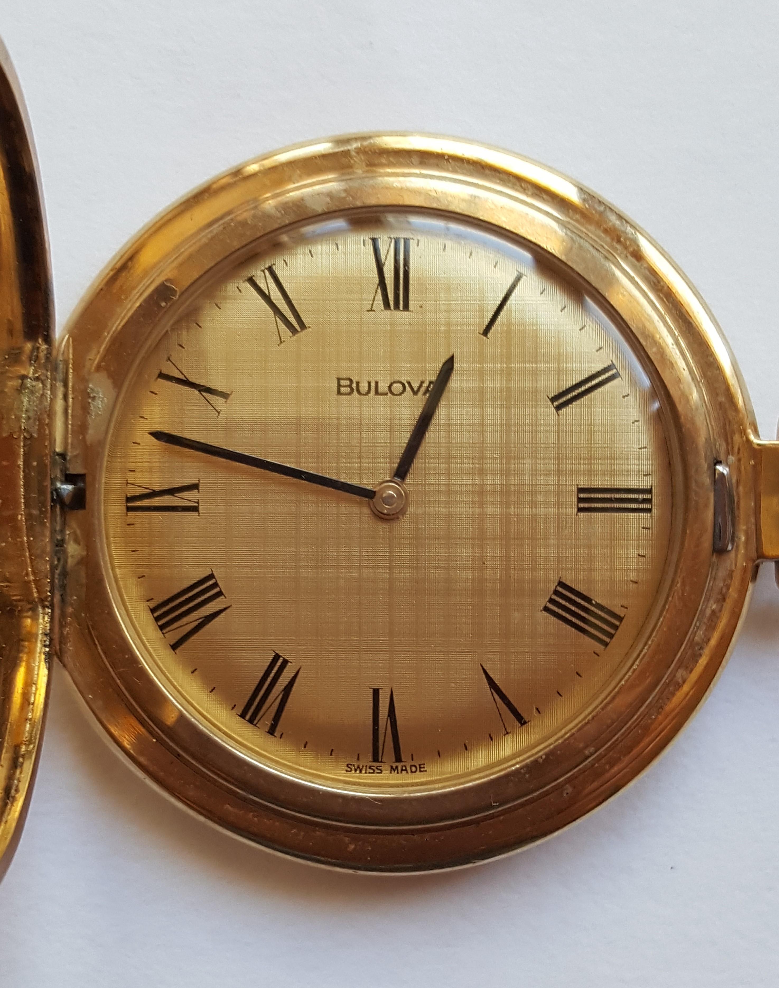 Vintage Gold Plated Bulova Pocket Watch, 1970's, 17 Jewel, Working, Unadjusted,  Excellent Condition, Bulova Watch Co., Swiss Made,  Black Roman Numerals. Gold Face, Textured Case Finish.

This is a beautiful watch and it's working.

This watch has