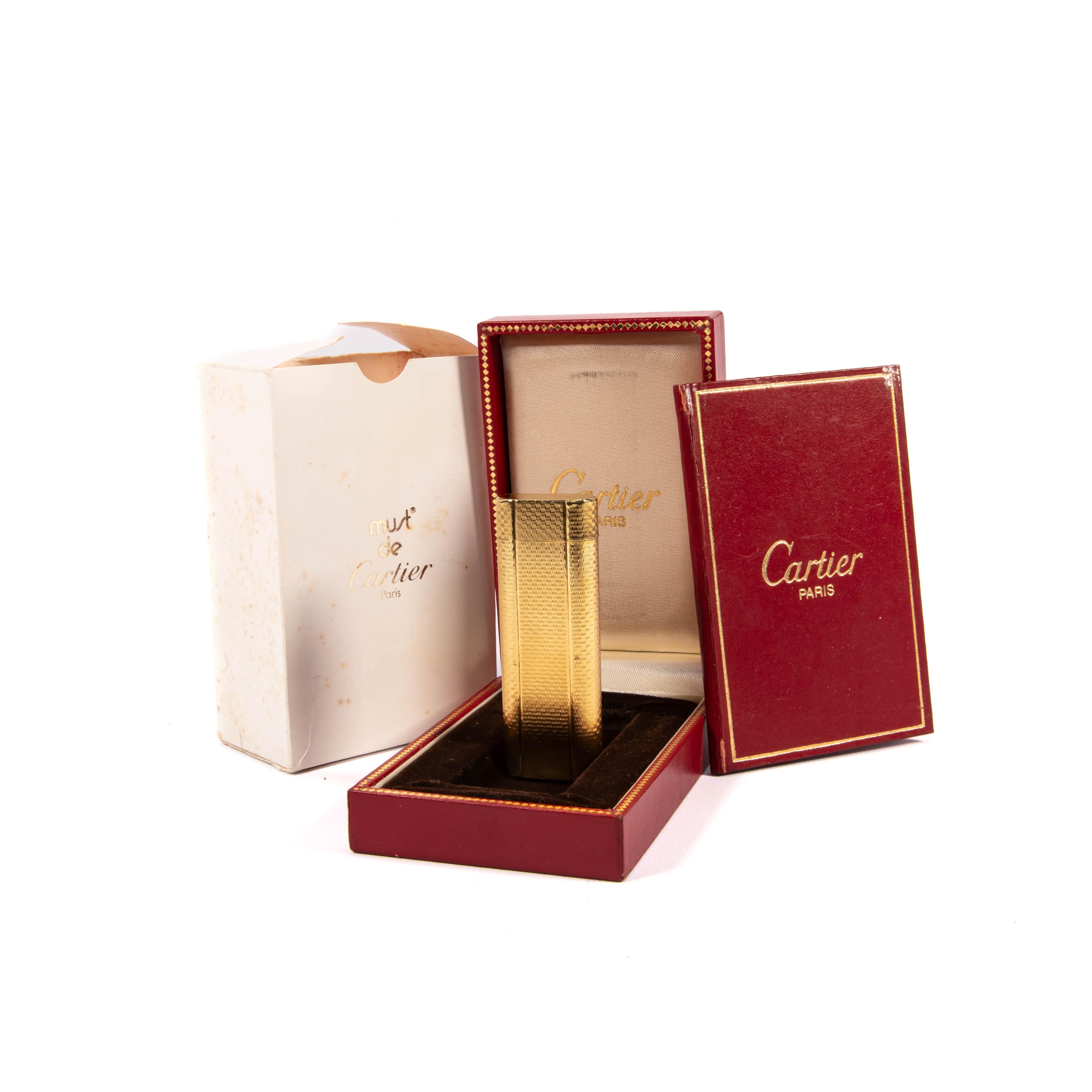 Vintage 1970s Cartier Les Must Gold-Plated Lighter

This stunning Cartier Les Must gold-plated lighter is a remarkable piece of luxury from the 1970s, offered as a complete set with its original box and packaging. Slightly used yet carefully