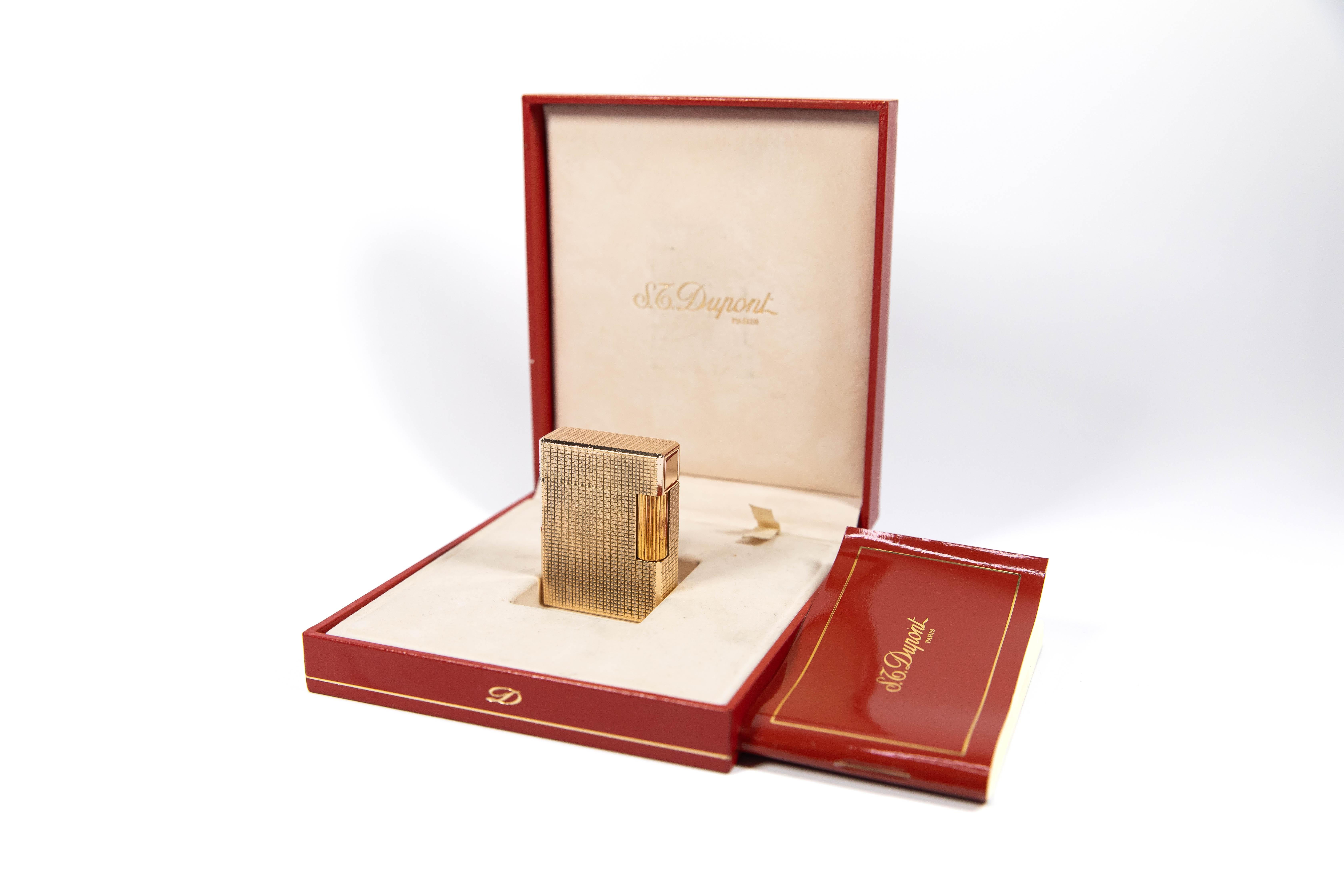 Vintage Gold Plated Ligne 1 BR ST Dupont Lighter

The iconic S.T. Dupont name is known for quality, well-made cigarette lighters and other luxury implements. The company’s origin can be traced to Simon Tissot-Dupont opening his workshop shop in