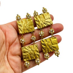 Vintage gold plated rhinestone designer runway clip on earrings