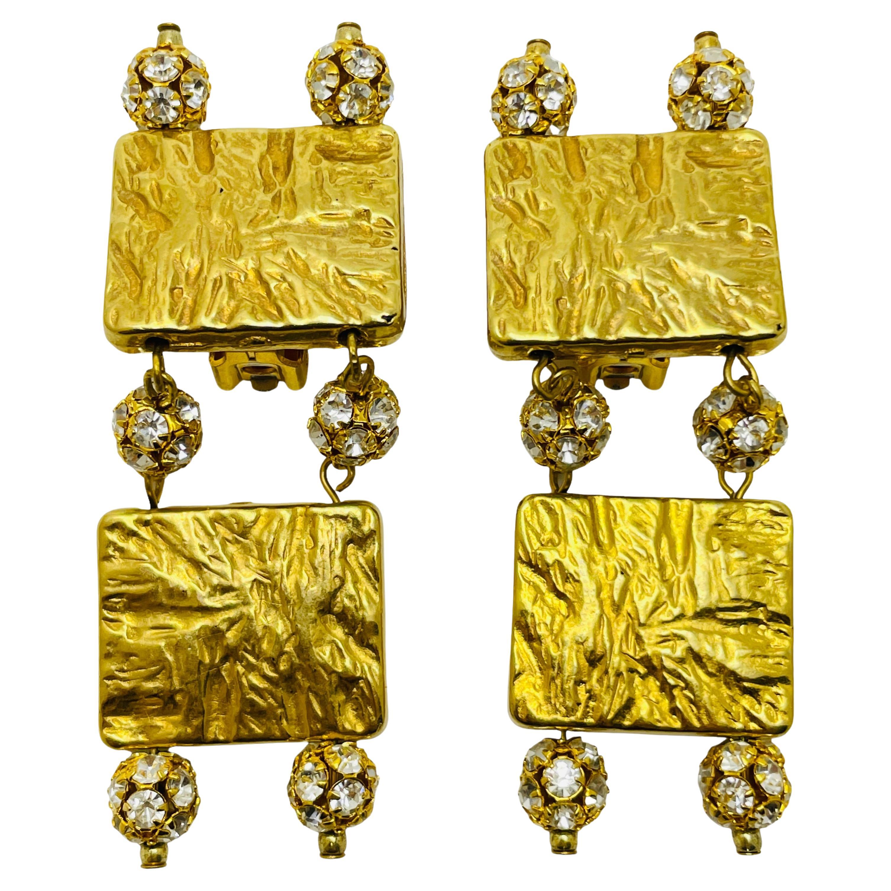 Vintage gold plated rhinestone designer runway clip on earrings For Sale