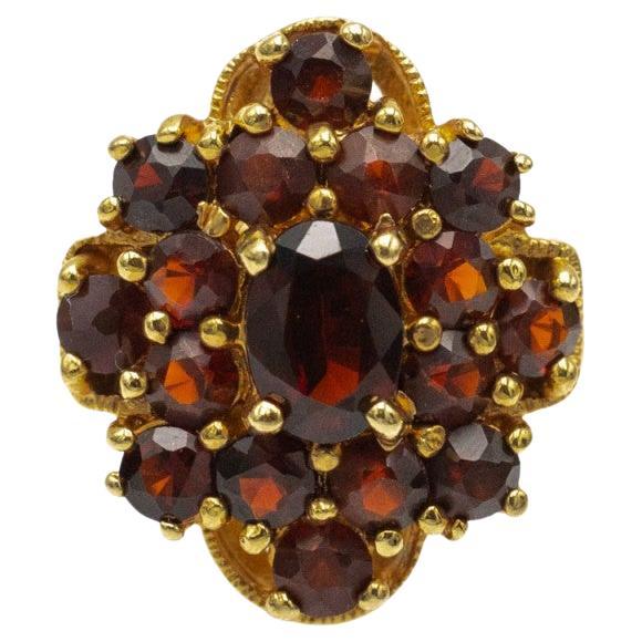 Vintage gold-plated ring with faceted natural red garnets.