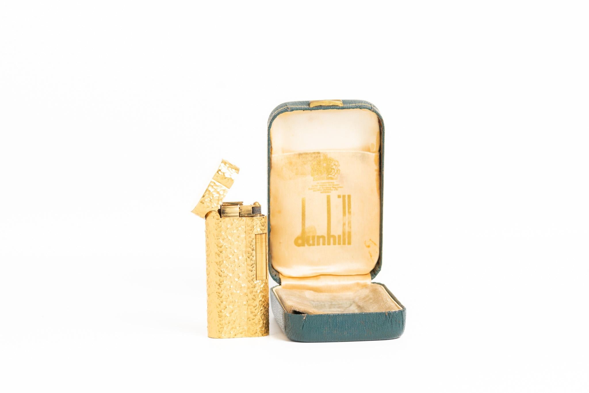 Rare and iconic Dunhill S Type 'Rollagas' Lighter, circa 1980 with an original blue box. The lighter has a beautiful hammered design and features 20 microns gold plate. Stamped on the bottom, with a serial number: D40998. The lighter comes with a