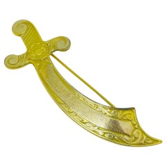 Vintage gold plated sword etched flower designer brooch marked TAS-ID