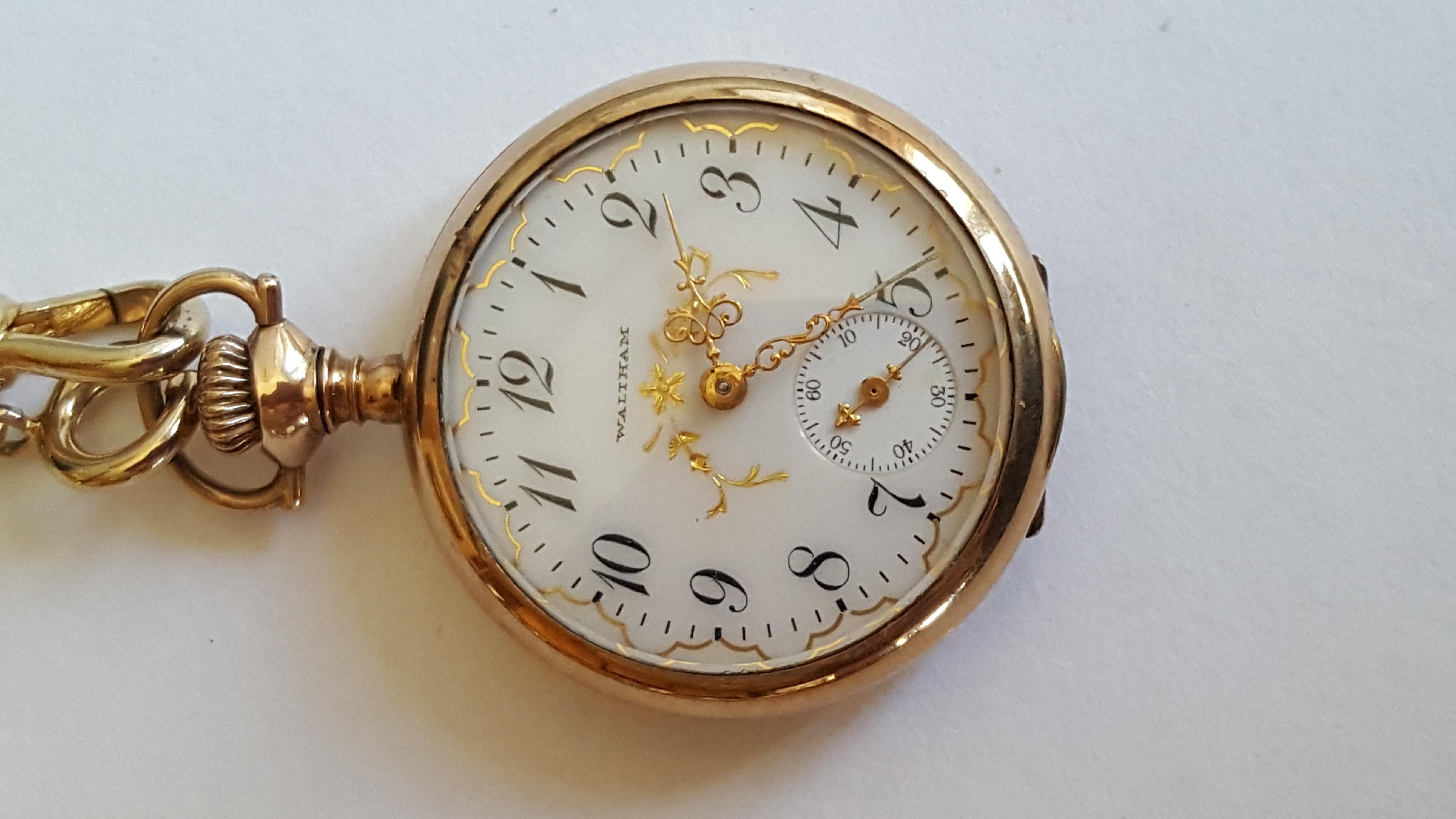 Vintage Gold Plated Waltham Pocket Watch, Year 1903, Model 1900, 15 Jewel, Open Face, 32 mm Small. Very nice watch is great condition, Case, White Face, Gold Detailing - Working. The seconds hand works. too. Comes with a wrist chain. 

This is a