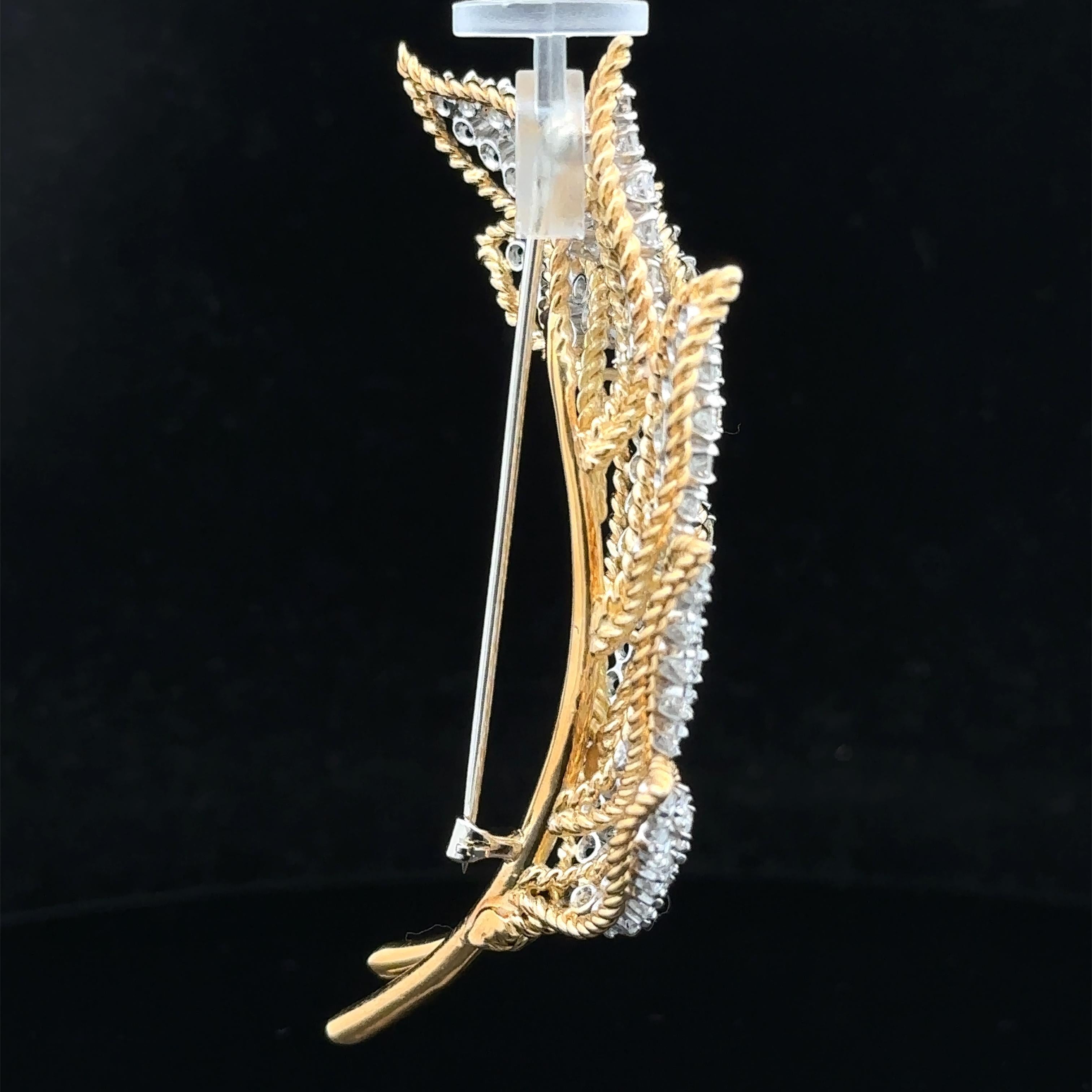--Stones:--
107 Genuine Diamonds - Round Brilliant Cut - Prong Set - Fiery - G/H Color - VS1-SI1 Clarity - 6.50ctw approx.

Material: Solid 18k Yellow Gold w/ Platinum Baskets Inside & 14k White Gold Pin
Weight: 26.92 Grams
Clasp: Pin w/ Rotating