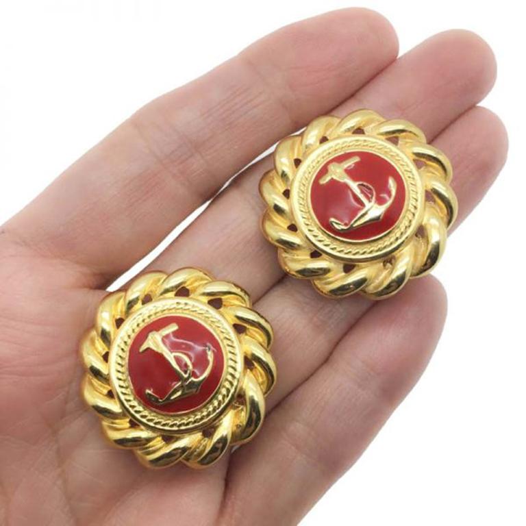 All at sea with these 1980s Vintage Nautical Earrings. Such a cool look with the vibrant red contrasting the rich golden hues. Crafted from gold plated metal with red enamelling these clips are fabulous quality. 
Measuring approx. 3.2cm and in very
