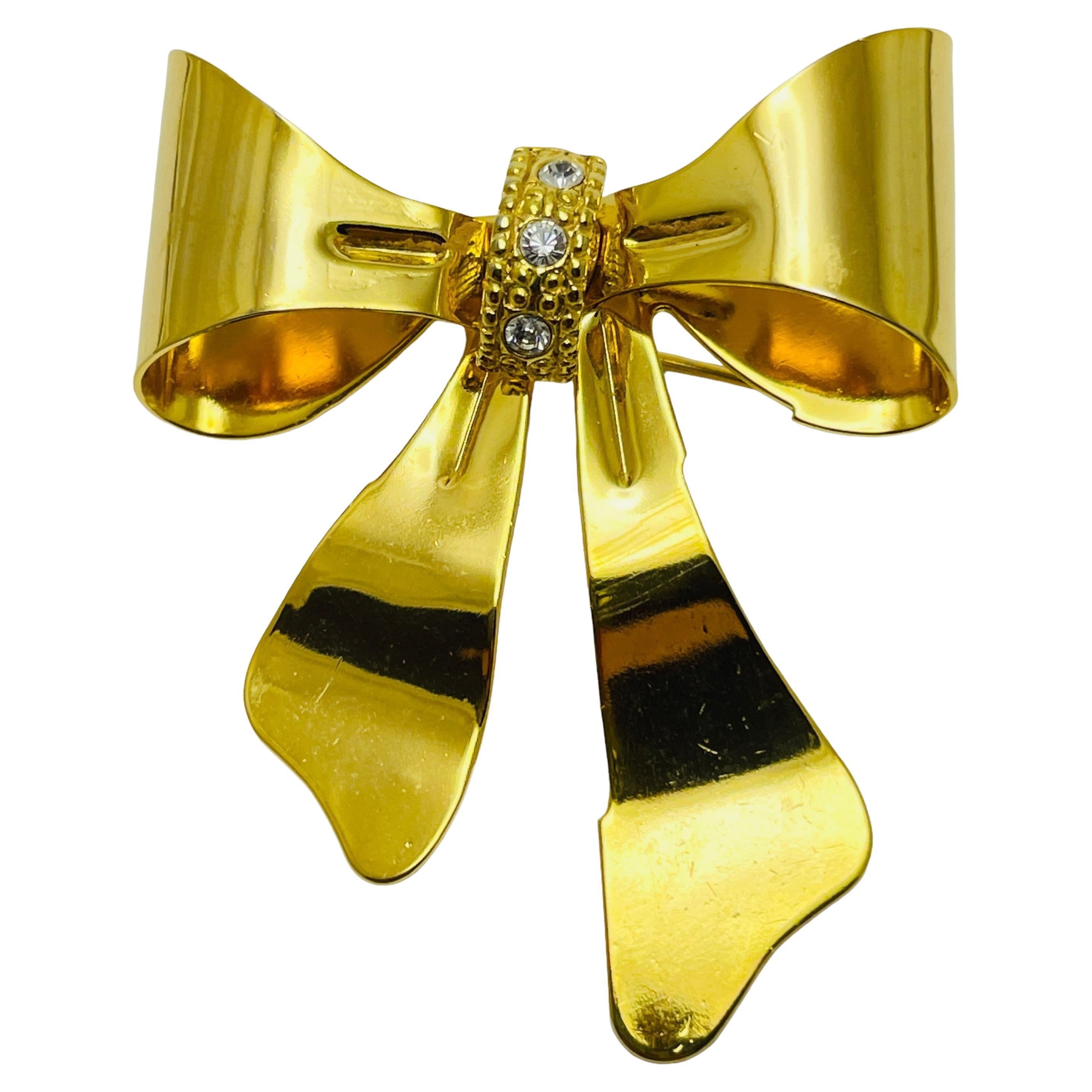 Vintage gold rhinestone bow brooch For Sale