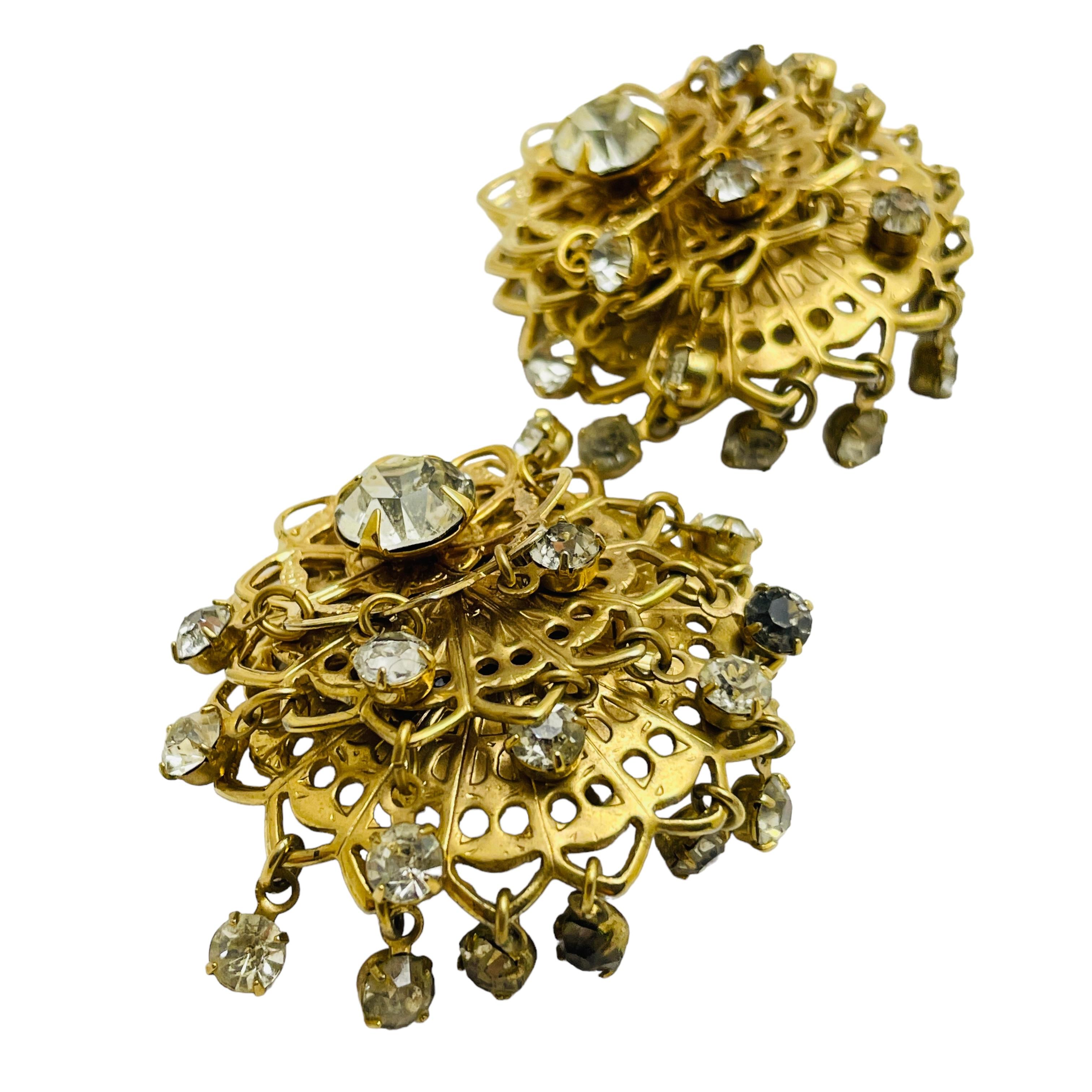 DETTAGLI

- senza segno    

- tono oro con strass

- orecchini vintage di design

MISURE  

- 

CONDIZIONE

-  ottime condizioni vintage con minimi segni di usura 

 Sku 43

❤️❤️  GIOIELLI VINTAGE DI DESIGN ❤️❤️

❤️❤️  LA BOUTIQUE DI ALEXANDER  ❤️❤️