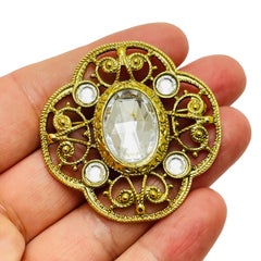 Vintage gold rhinestone designer runway brooch