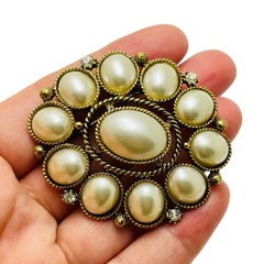 Vintage gold rhinestone designer runway brooch