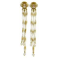 Vintage gold rhinestone designer runway pierced earrings
