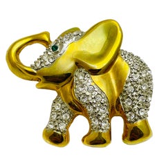 Vintage gold rhinestone emerald eyes elephant figural designer brooch
