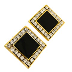 Vintage gold rhinestone enamel designer runway clip on earrings