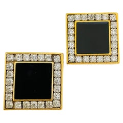Vintage gold rhinestone enamel designer runway clip on earrings
